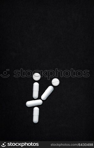 Creative still life of AIDS transmission via vaginal or anal sex; medicine concept made of drugs and pills.
