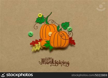 Creative thanksgiving day concept photo of pumpkin made of paper on brown background.