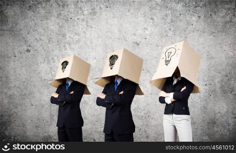 Creative thinking. Unrecognizable business people with carton boxes on head