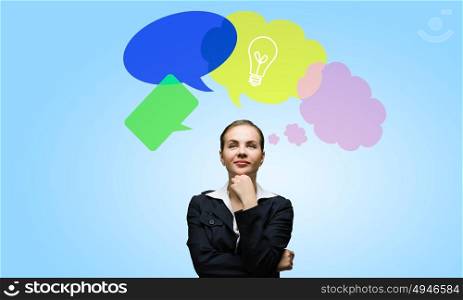 Creative thinking. Young attractive woman and colorful thoughts above her head