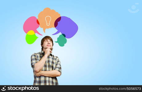 Creative thinking. Young man and colorful thoughts above her head