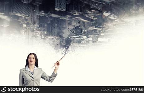 Creative thinking. Young pretty businesswoman holding paint brush. Creativity concept