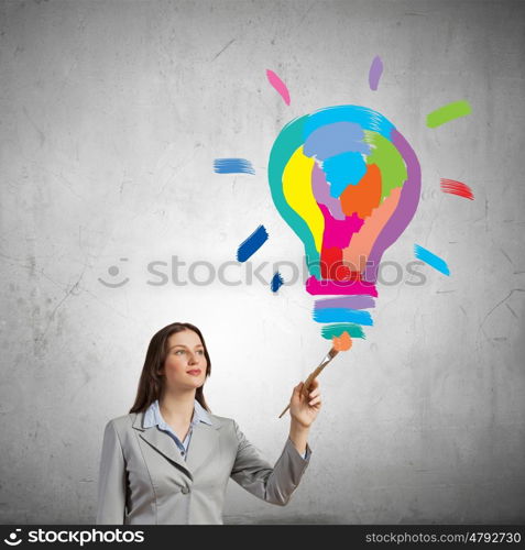 Creative thinking. Young pretty businesswoman holding paint brush. Creativity concept