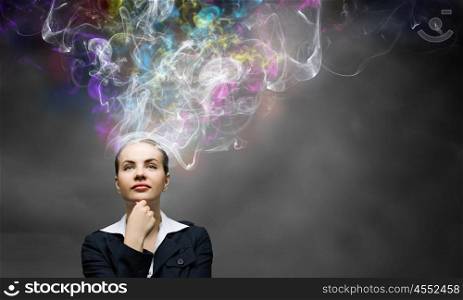 Creative thinking. Young pretty businesswoman thinking over the ideas. Creativity concept