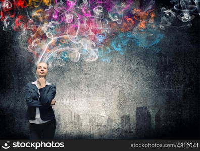 Creative thinking. Young pretty businesswoman thinking over the ideas. Creativity concept