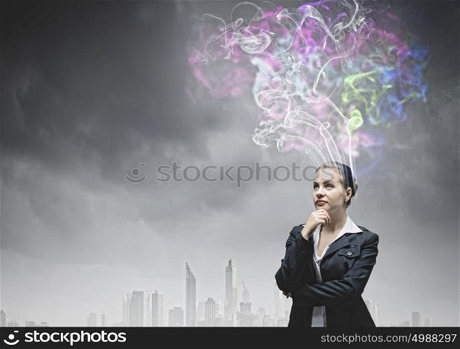 Creative thinking. Young pretty businesswoman thinking over the ideas. Creativity concept