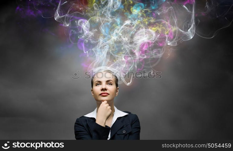 Creative thinking. Young pretty businesswoman thinking over the ideas. Creativity concept