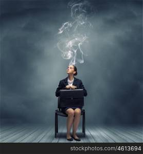 Creative thinking. Young thoughtful confused businesswoman sitting on chair