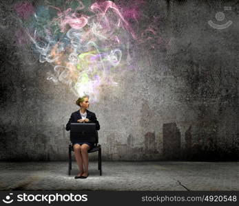 Creative thinking. Young thoughtful confused businesswoman sitting on chair