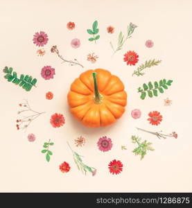Creative Top view flat lay autumn composition. Pumpkins dried flowers leaves color paper background copy space. Square Template fall harvest thanksgiving halloween anniversary invitation cards
