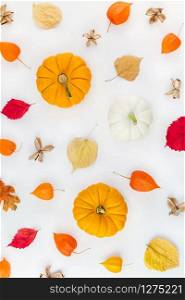 Creative Top view flat lay autumn composition. Pumpkins dried orange flowers leaves background pattern copy space. Template fall harvest thanksgiving halloween anniversary invitation cards