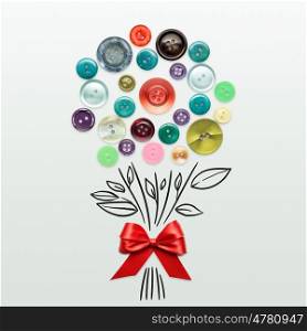 Creative valentines concept photo of a bouquet mad of buttons with a bow on grey background.