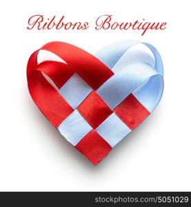 Creative valentines concept photo of a heart mad of ribbon on white background.