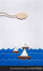 Creative valentines concept photo of boats on the sea made of paper on white background.