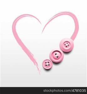 Creative valentines concept photo of buttons and illustrated heart on white background.