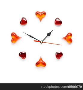 Creative valentines concept photo of clock with hearts on white background.