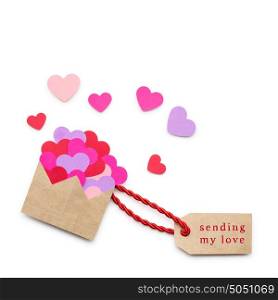 Creative valentines concept photo of envelope with hearts made of paper on white background.