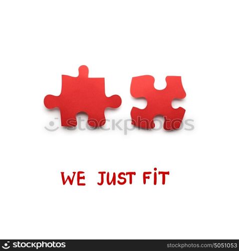 Creative valentines concept photo of puzzle pieces on white background.