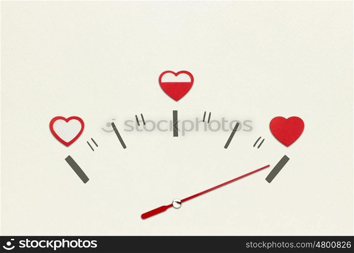 Creative valentines concept photo of speedometer with hearts on grey background.