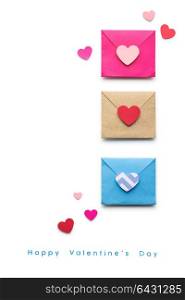Creative valentines concept photo of three envelopes with hearts made of paper on white background.