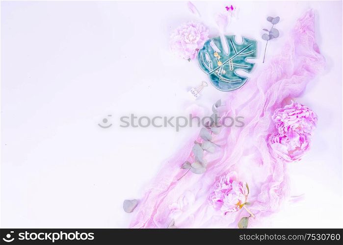 Creative wedding composition mock up, pink blanket, flowers, eucalyptus branches, copy space on white background. Flat lay, top view stylish art concept, toned. Creative wedding composition