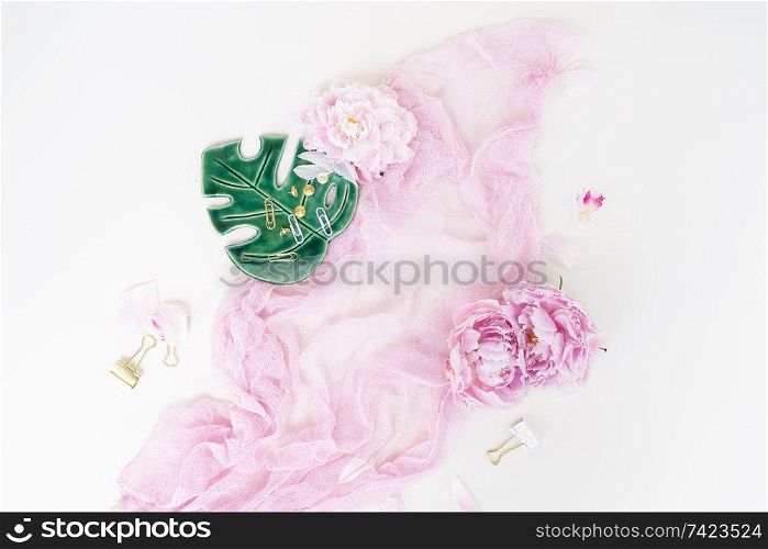 Creative wedding composition, pink blanket, flowers on white background. Flat lay, top view stylish art concept.. Creative wedding composition
