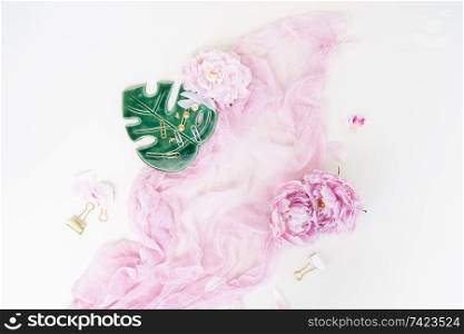 Creative wedding composition, pink blanket, flowers on white background. Flat lay, top view stylish art concept.. Creative wedding composition