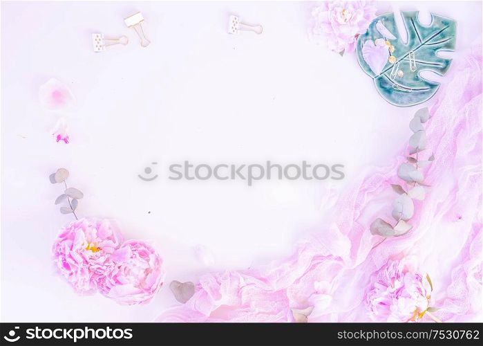 Creative wedding frame composition mock up, pink blanket, flowers, eucalyptus branches, copy space on white background. Flat lay, top view stylish art concept, toned. Creative wedding composition