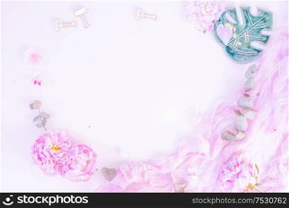 Creative wedding frame composition mock up, pink blanket, flowers, eucalyptus branches, copy space on white background. Flat lay, top view stylish art concept, toned. Creative wedding composition