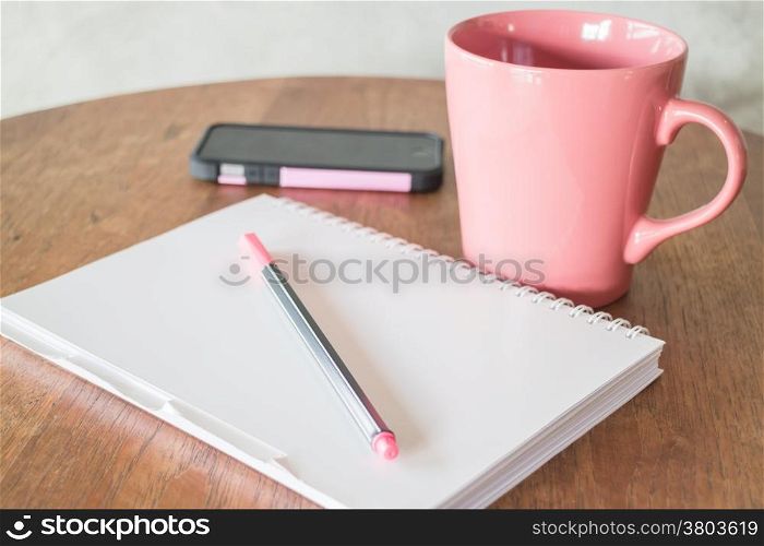 Creative work table in coffee shop, stock photo