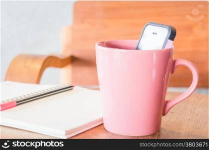 Creative work table with notepaper and mobile phone, stock photo