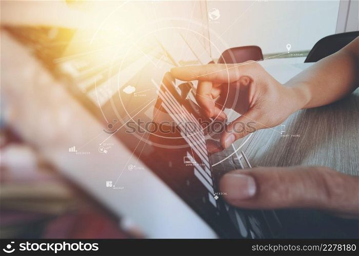 creative working with mobile phone and digital tablet and laptop computer on wooden desk in modern office with virtual icon diagram