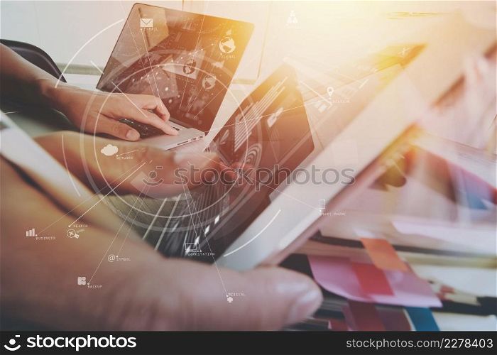 creative working with mobile phone and digital tablet and stylus pen on wooden desk in modern office with virtual icon diagram