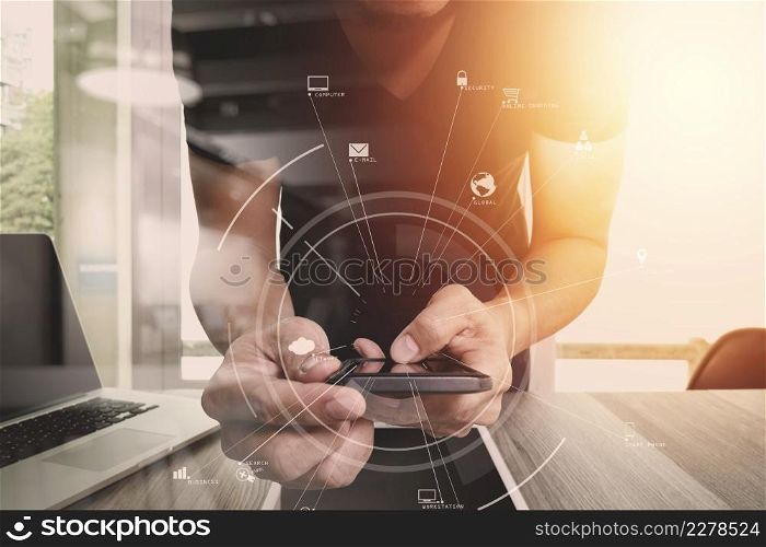 creative working with mobile phone and digital tablet and stylus pen on wooden desk in modern office with virtual icon diagram