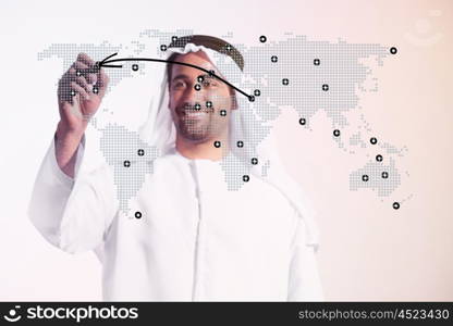 creative young middle eastern business man draw graph and diagrams with marker on virtual screen