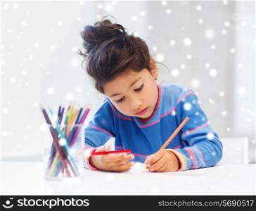 creativity, childhood and people concept - little girl with pencils drawing at home