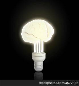 Creativity concept. Glowing light bulb and brain icon on black background