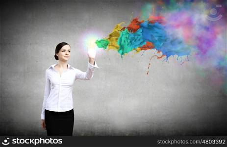 Creativity concept. Young pretty woman in shirt and colorful splashes