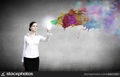 Creativity concept. Young pretty woman in shirt and colorful splashes
