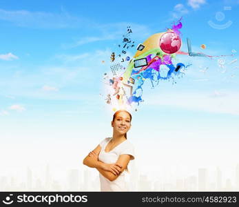 Creativity concept. Young smiling woman with colorful thoughts above head