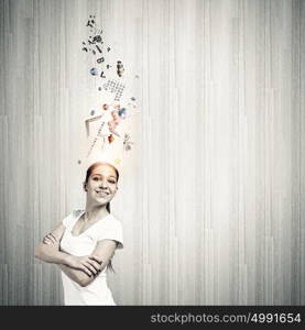 Creativity concept. Young smiling woman with colorful thoughts above head