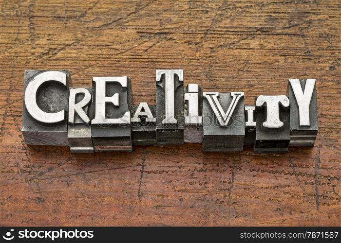 creativity word in mixed vintage metal type printing blocks over grunge wood