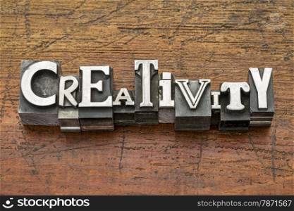 creativity word in mixed vintage metal type printing blocks over grunge wood