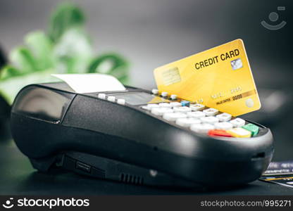 Credit card reader machine or Payment terminal with credit card on table