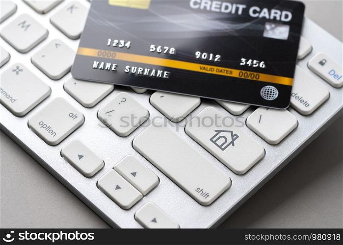 Credit card with icon on keyboard for property concept