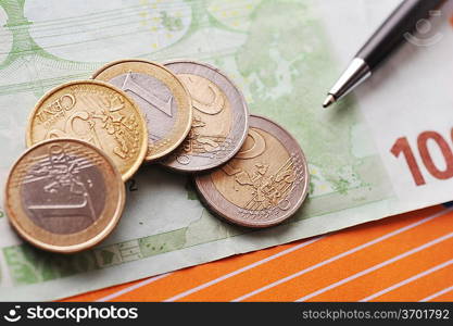 Credit cards, black pen and money on table close up