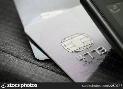 Credit cards in very shallow focus  with gray suit background