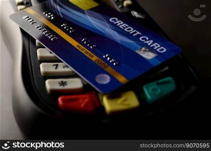 Credit cards placed on credit card swipes