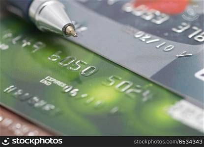 Credit cards with pen- concept finance background. Credit cards with pen