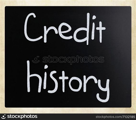 ""Credit history" handwritten with white chalk on a blackboard"